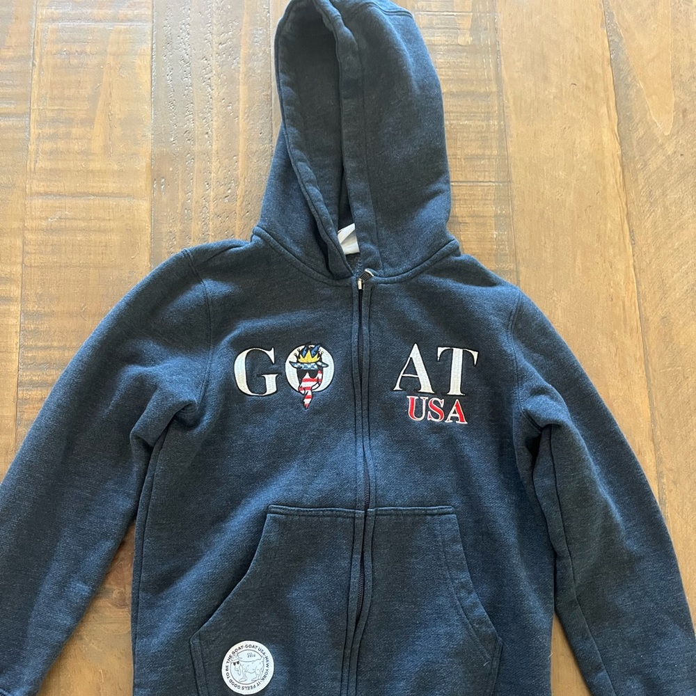 Goat zip up jacket. Navy blue. Youth large. Hardly worn. Like new!